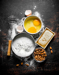 Baking background. Flour with honey, nuts and eggs.
