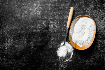 Flour in bowl and ladle.