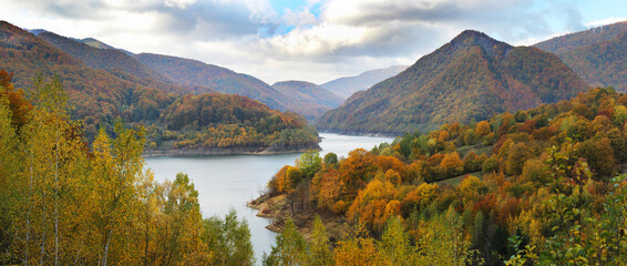 Beautiful autumn landscape with lake in the mountains