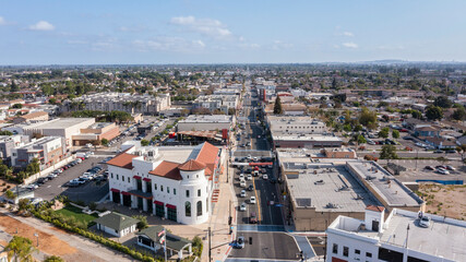 Daytime aerial view of the historic urban core of downtown Bellflower, California, USA. - obrazy, fototapety, plakaty