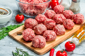 Raw beef meatballs with herbs and spices.