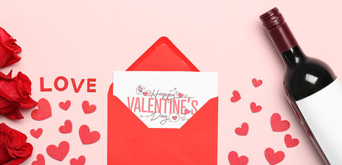 Bottle of wine, envelope, paper hearts and rose flowers on pink background. Valentine's Day celebration