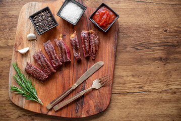 grilled beef steak on wooden background  with copy space for your text