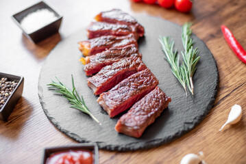 grilled beef steak on wooden background 