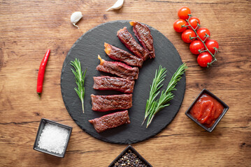grilled beef steak on wooden background 