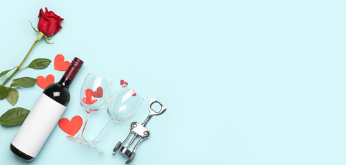 Bottle of wine, rose flower, hearts and glasses on light blue background with space for text. Valentine's Day celebration