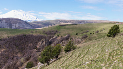 view from the hill to the snow-capped mountains of Elbrus in the Caucasus, Russia