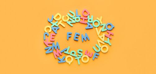 Many letters with word FEM on orange background. Concept of feminism