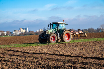 Fototapeta premium tractor plowing the fielld