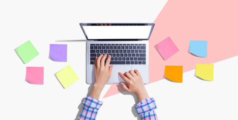 Laptop computer with many sticky notes