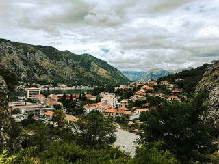 Fototapeta na wymiar Views overlooking the city streets and waterfront of Kotor Montenegro in a european summer