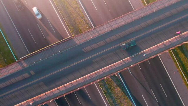 aerial view of bridge and highway with vehicles circulating