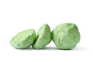 Marshmallow isolated on white background. A whole and two halves of a green marshmallow on white. Sweet dessert