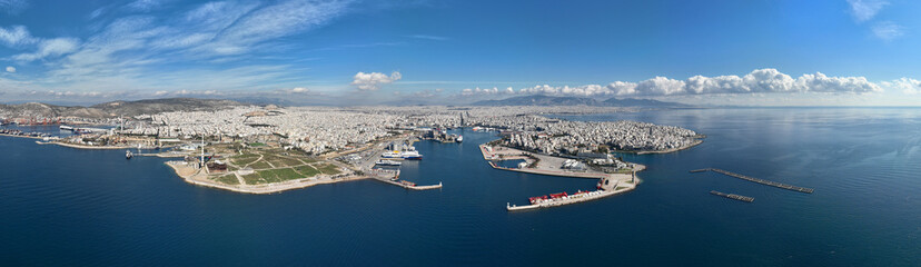 Obraz premium Aerial drone ultra wide panoramic photo from busy port of Piraeus where passenger ships travel to Aegean destination islands, Attica, Greece