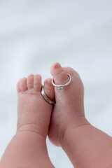 Engagement ring on baby's feet
