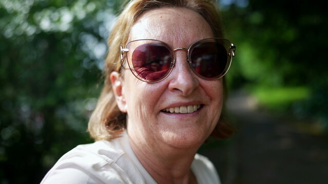 Senior lady wearing big sunglasses outdoors portrait older woman