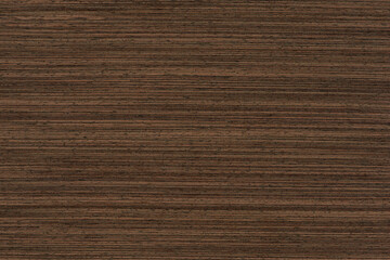 Texture of wenge wood. Dark brown wenge background. Natural brown wood texture, solid natural wood...