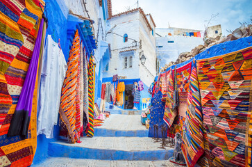Street market in blue medina of city Chefchaouen,  Morocco, Africa. - obrazy, fototapety, plakaty