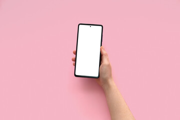 Female hand with modern mobile phone on pink background, closeup