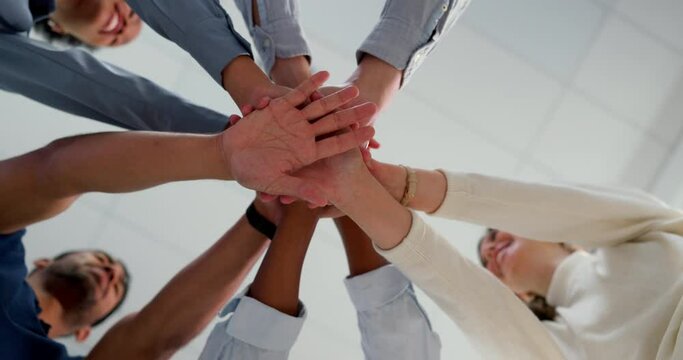 Business people, hands and together with team and support, collaboration and team building low angle. Business meeting, connection with trust, community and solidarity with teamwork and motivation