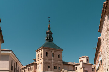 Fototapeta na wymiar Toledo, España. April 29, 2022: Domes and facade of city churches with blue sky.