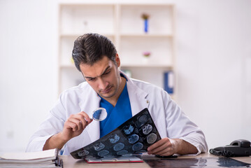 Young male doctor radiologist working in the clinic