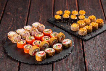 Large sushi set. An assortment of various maki nigiri and rolls seafood soy sauce