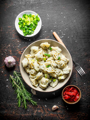 Dumplings with beef, chopped onions, tomato paste and rosemary.