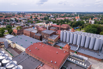 Brewery factory in Tychy, Poland from an aerial view on a beautiful sunny day. A giant beer brewing industry located in the Silesian Voivodeship.