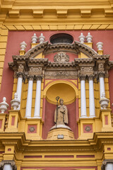 Fototapeta na wymiar Neoclassical style church of San Ildefonso (Iglesia de San Ildefonso) with two graceful baroque towers was constructed in the 18th century. Seville, Andalusia, Spain.