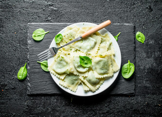 Ravioli on a plate with a fork.