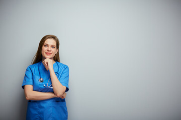 Thinking doctor woman or nurse in blue medical suit.