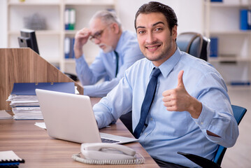 Two male colleagues working in the office