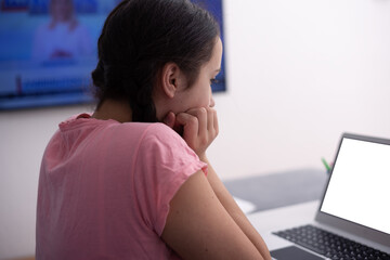 Young female Student doing complicated homework online