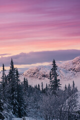 Mountain peak during sunrise . Natural landscape in the Norway at winter time.