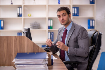Young male employee working in the office