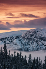 Mountain peak during sunrise . Natural landscape in the Norway at winter time.