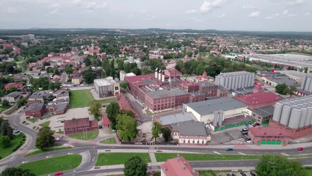 Brewery factory in Tychy, Poland from an aerial view on a beautiful sunny day. A giant beer brewing industry located in the Silesian Voivodeship.