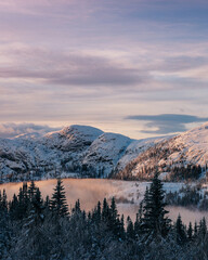 Fototapeta na wymiar Mountain peak during sunrise . Natural landscape in the Norway at winter time.