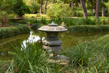 sculpture beside a pond