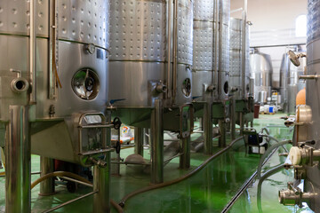 Metallic cisterns for processing and fermentating wine in fabric shop