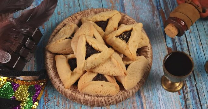 Jewish carnival traditional hamantaschen cookies with hamantaschen decorations to celebrate Purim