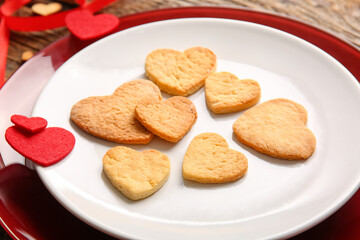 Plate with sweet heart shaped cookies, closeup. Valentines Day celebration