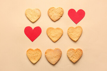 Composition with sweet cookies and paper hearts on color background. Valentines Day celebration