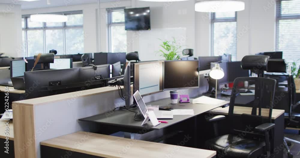 Poster general view of empty modern office with multiple computers, slow motion