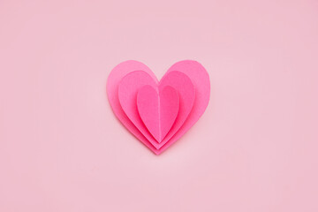 Paper heart on pink background. Valentines Day celebration
