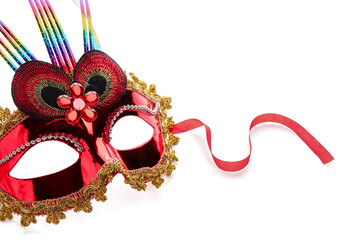 Red carnival mask for Mardi Gras celebration on white background, closeup