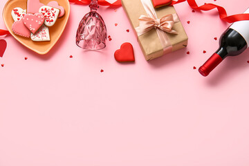 Composition with bottle of wine, glass, cookies and gift for Valentines Day on pink background