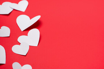 Beautiful paper hearts on red background. Valentines Day celebration