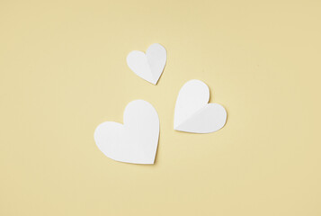 Composition with paper hearts on color background. Valentines Day celebration